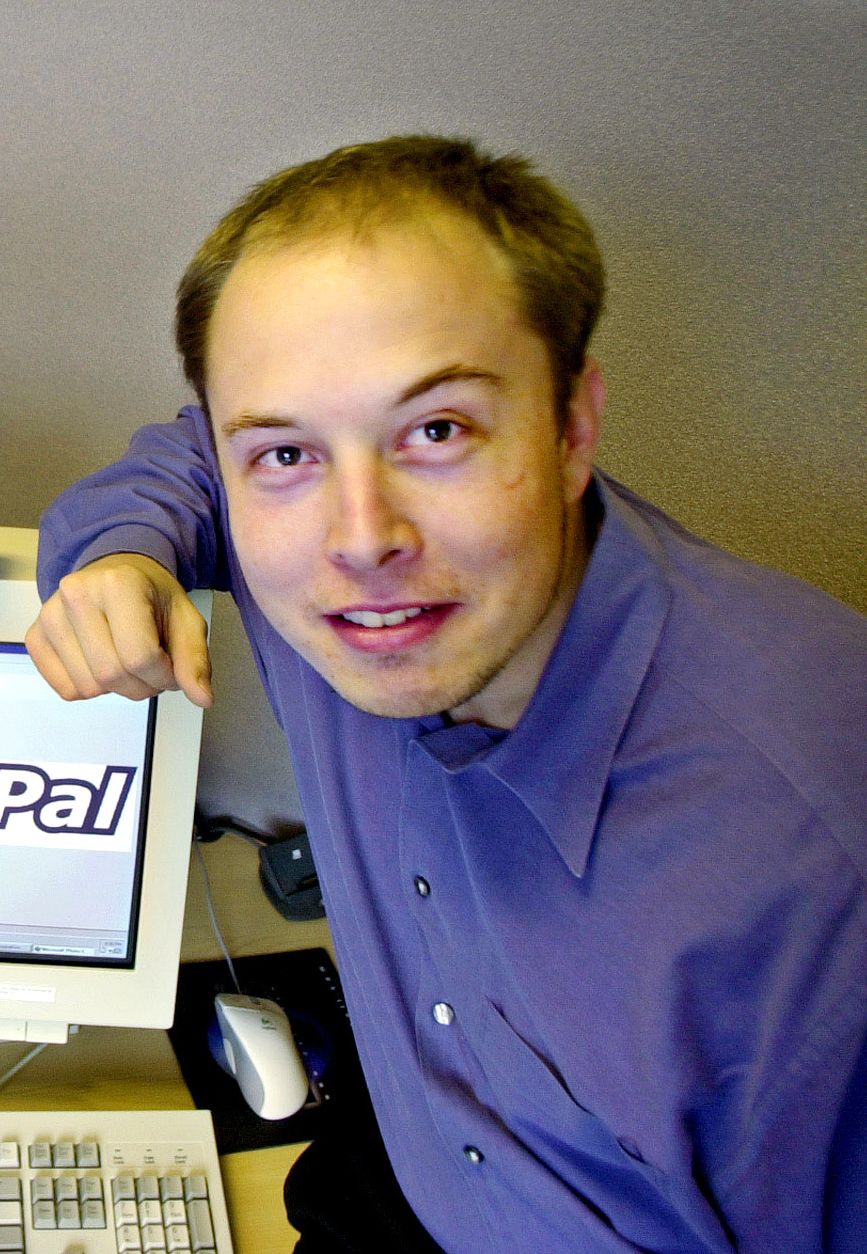 Image may contain Ashlee Vance Computer Electronics Laptop Pc Face Head Person Photography Portrait and Furniture