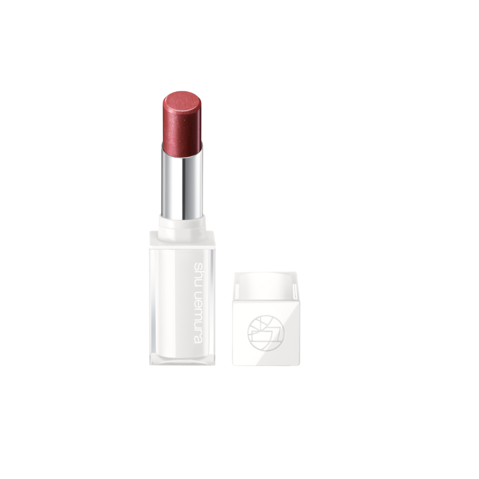 lipstick with a shimmering reddish tint in a transparent case