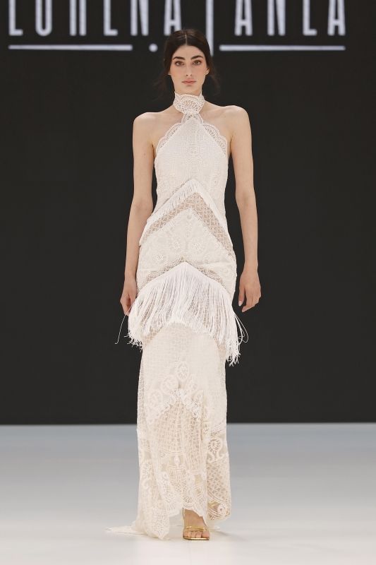 Image may contain Fashion Clothing Dress Formal Wear Gown Wedding Wedding Gown Adult and Person