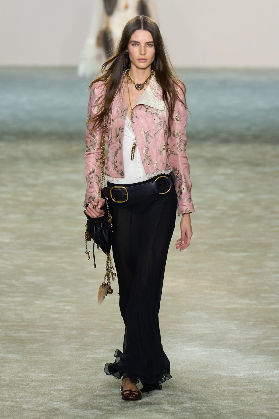 fashion model showcasing a stylish outfit on the runway