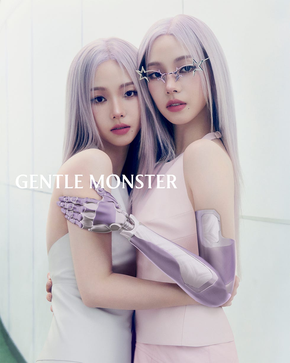 two individuals with synthetic arms embracing showcasing advanced prosthetic technology