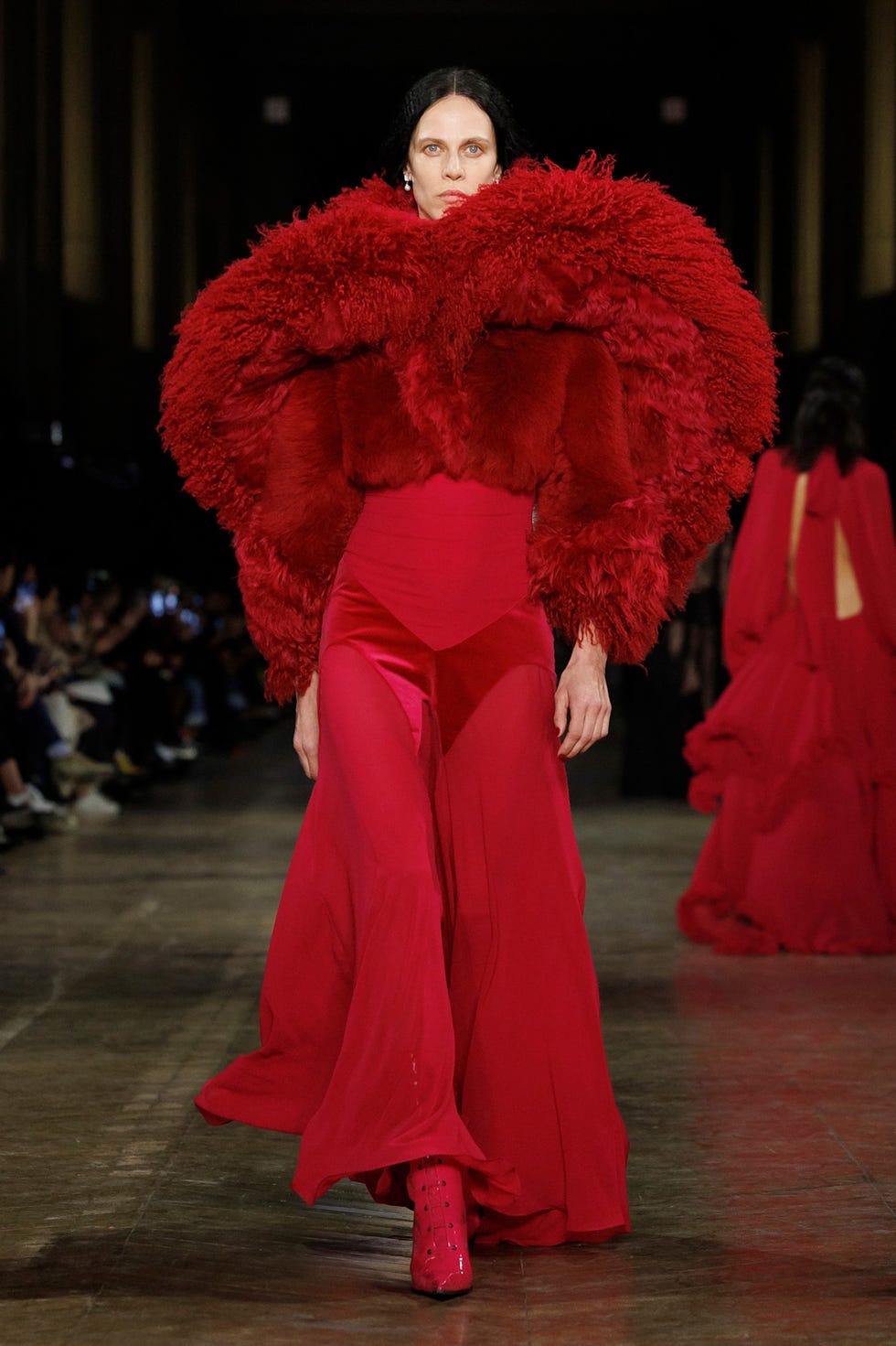 Fashion runway showcasing a striking red outfit