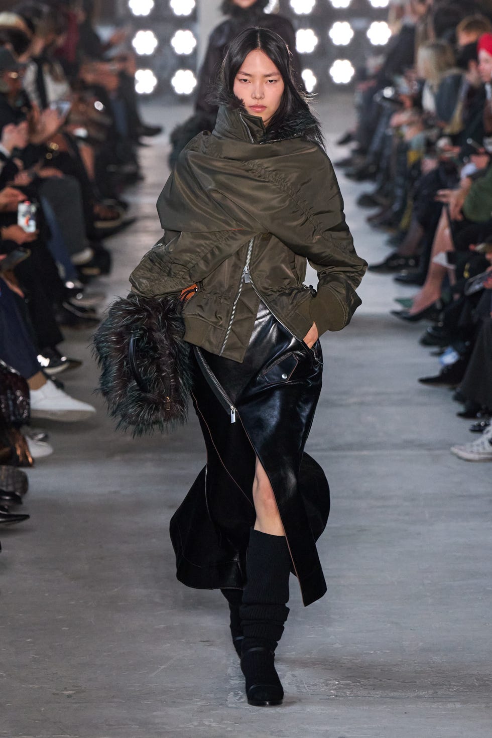 Fashion runway featuring a model in a stylish outfit