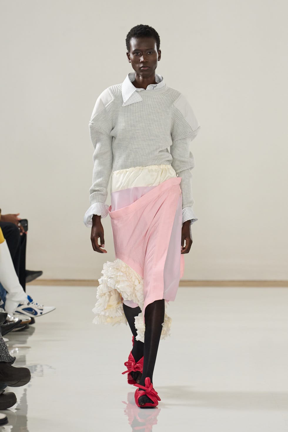 Fashion model showcasing a unique outfit on a runway