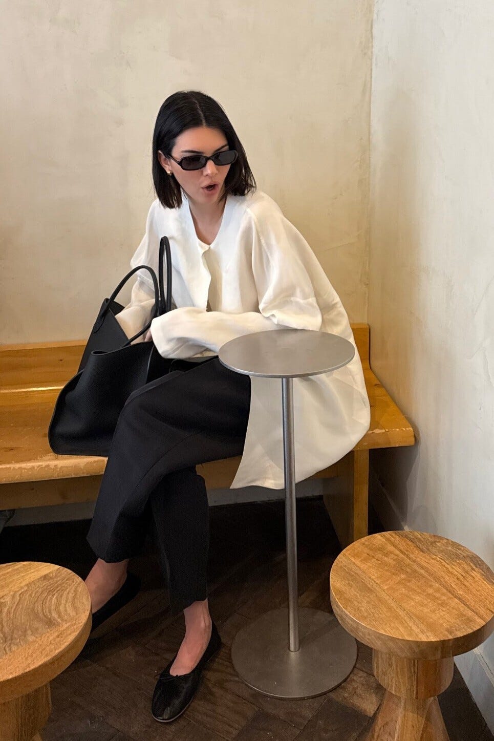 a person seated in a café environment with a modern design