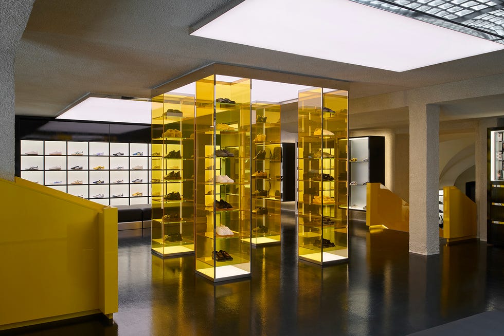 retail space featuring a modern shoe display with yellow elements
