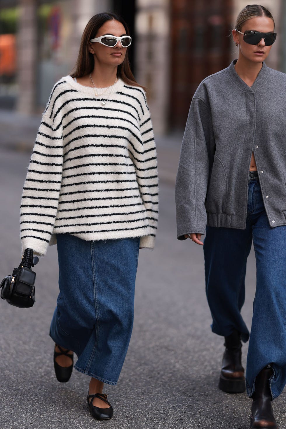 two women walking on a city street showcasing casual fashion