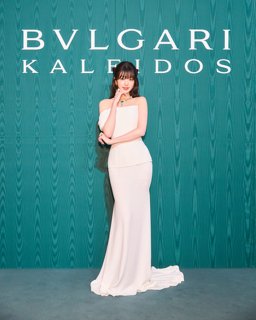 model posing in front of a bvlgari display