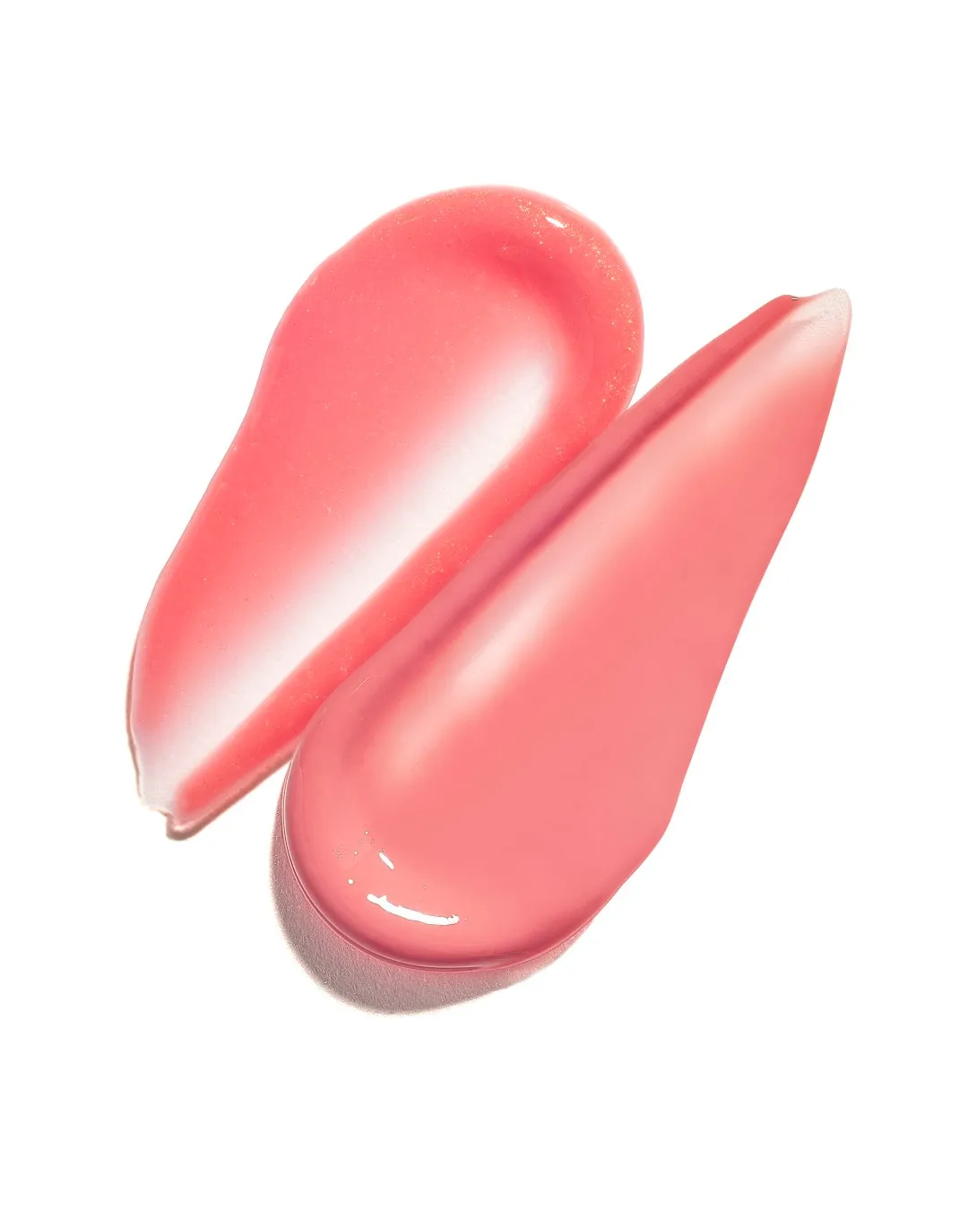 ピンク色のリップグロスが2つ、白地に塗られた様子