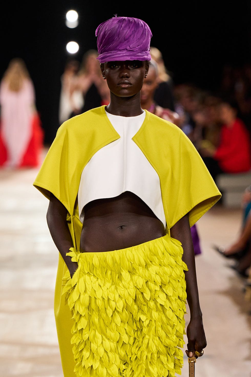 fashion model showcasing an avantgarde outfit with bright colors