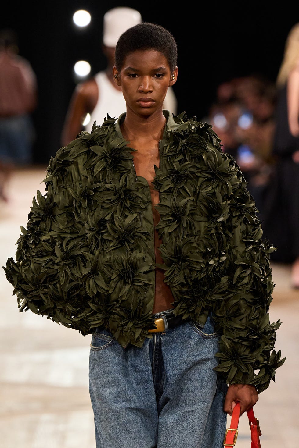 a model showcasing a unique floraltextured jacket