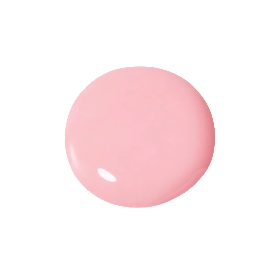 ピンク色の円形の物体が、白い背景に配置されています。光沢があり、滑らかな表面を持っています。