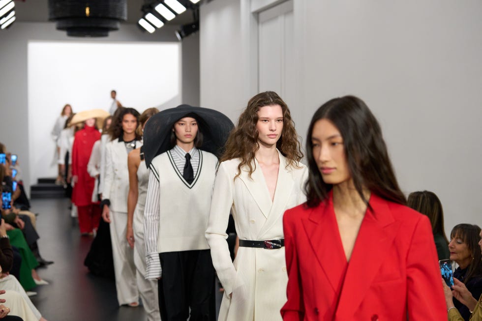 fashion runway showcasing a diverse collection of models in various stylish outfits