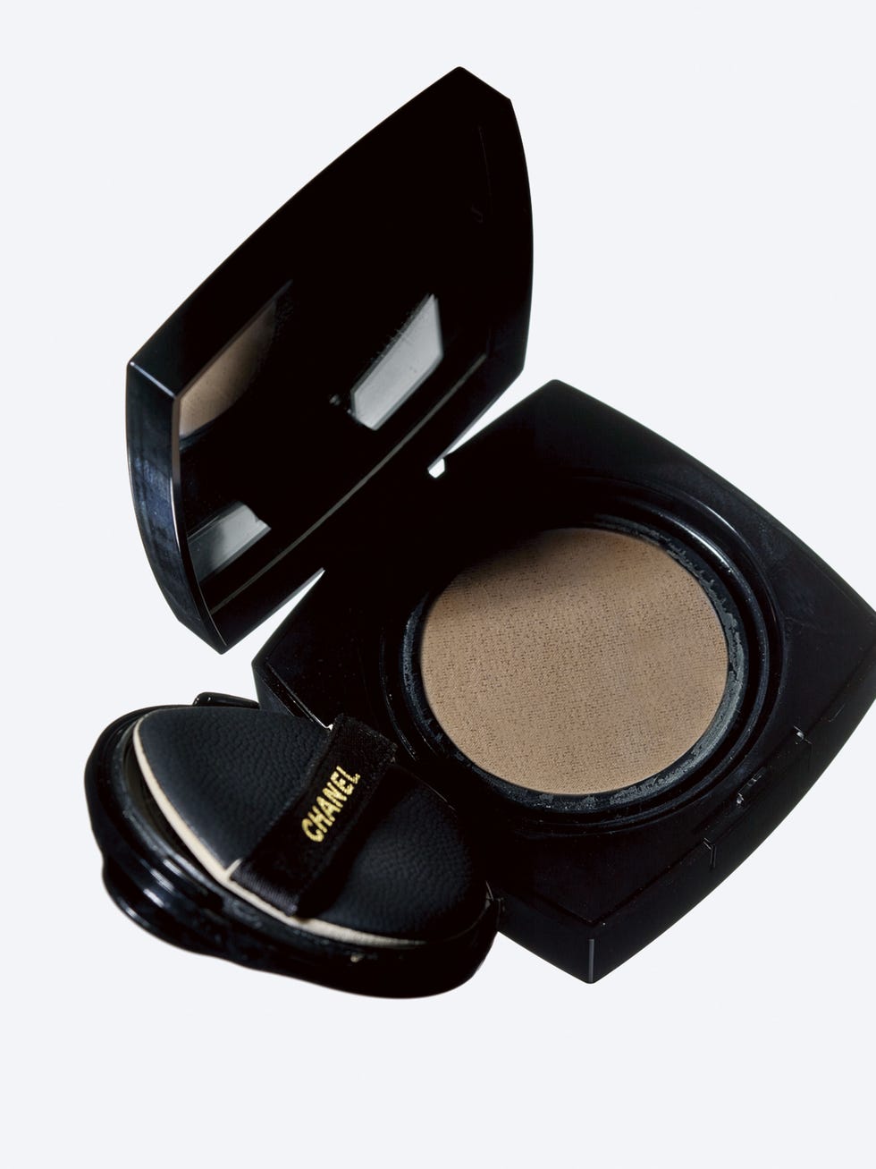 compact makeup case with mirror and sponge applicator