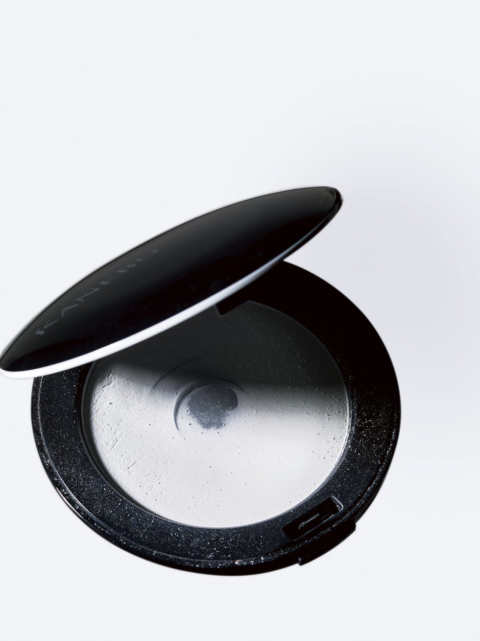 opened cosmetic powder compact