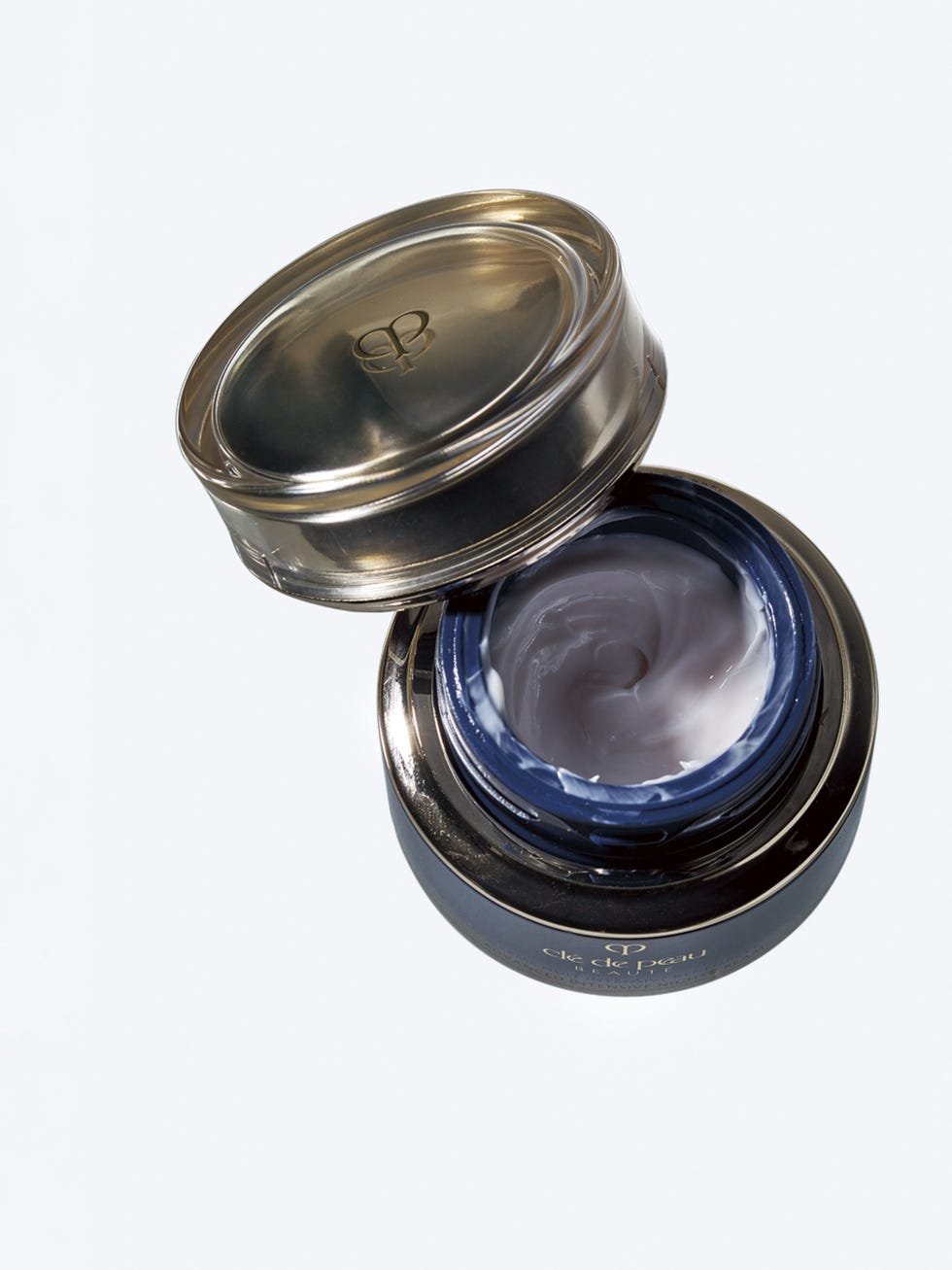 opened jar of cream with a smooth texture inside