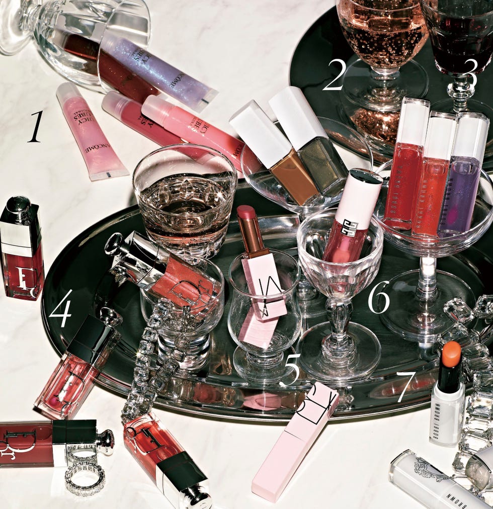 array of lip products and beverages on a silver tray