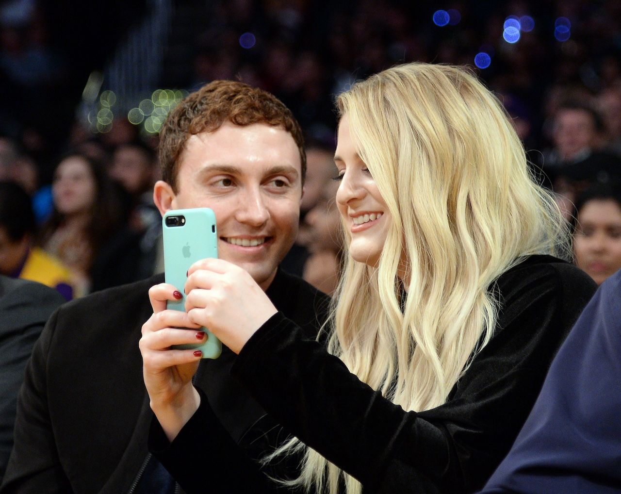 LOS ANGELES CA MARCH 21 Daryl Sabara and Meghan Trainor attend a basketball game between Los Angeles Clippers and Los...