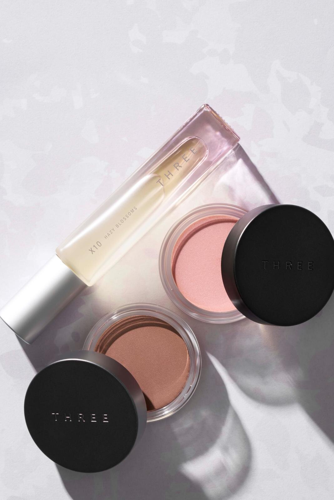 THREE26年春コスメ、“桜香る”ハーバルフローラル香水＆アイにもリップにも使える春色バーム｜写真1