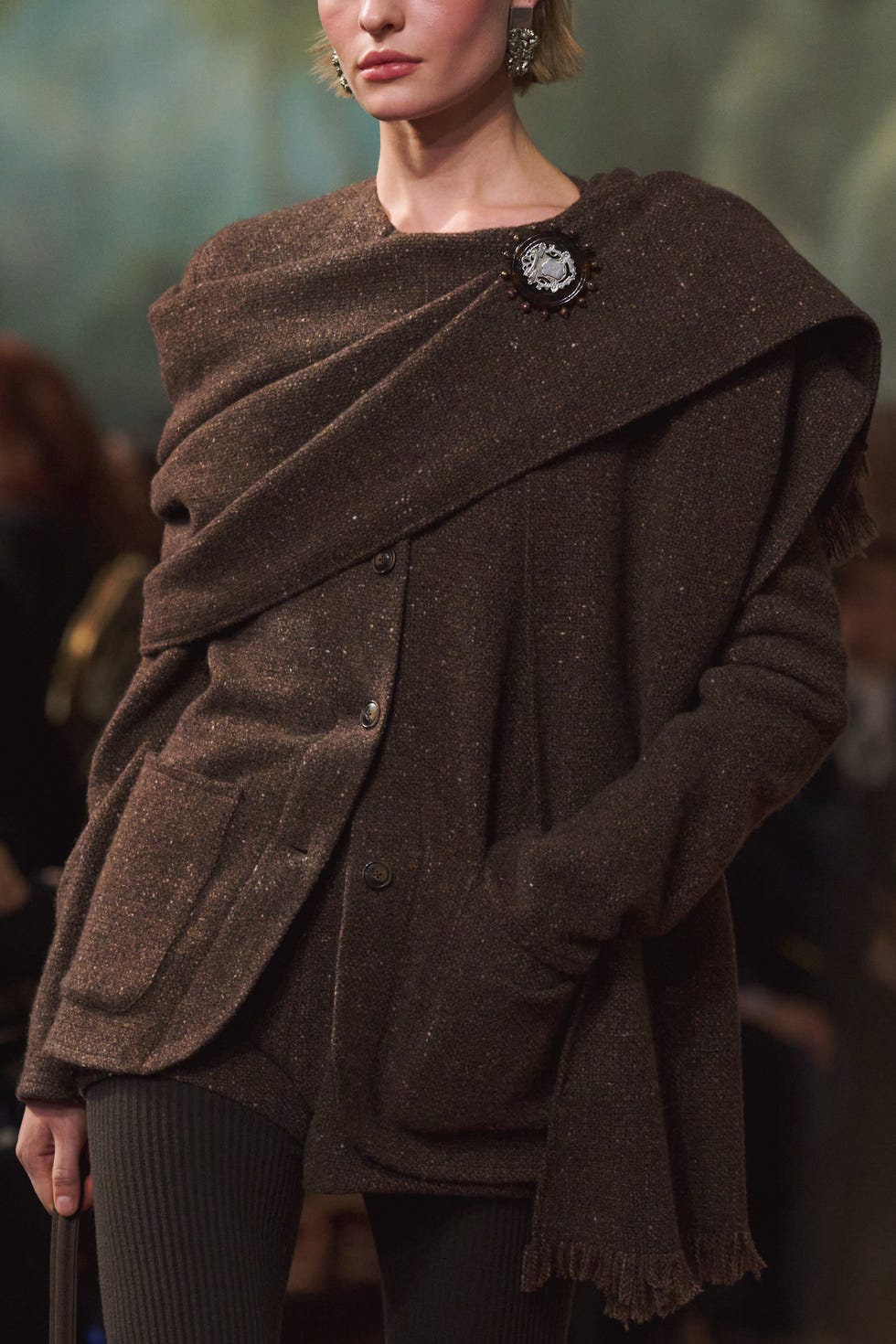 fashion ensemble featuring a brown shawl and textured fabric