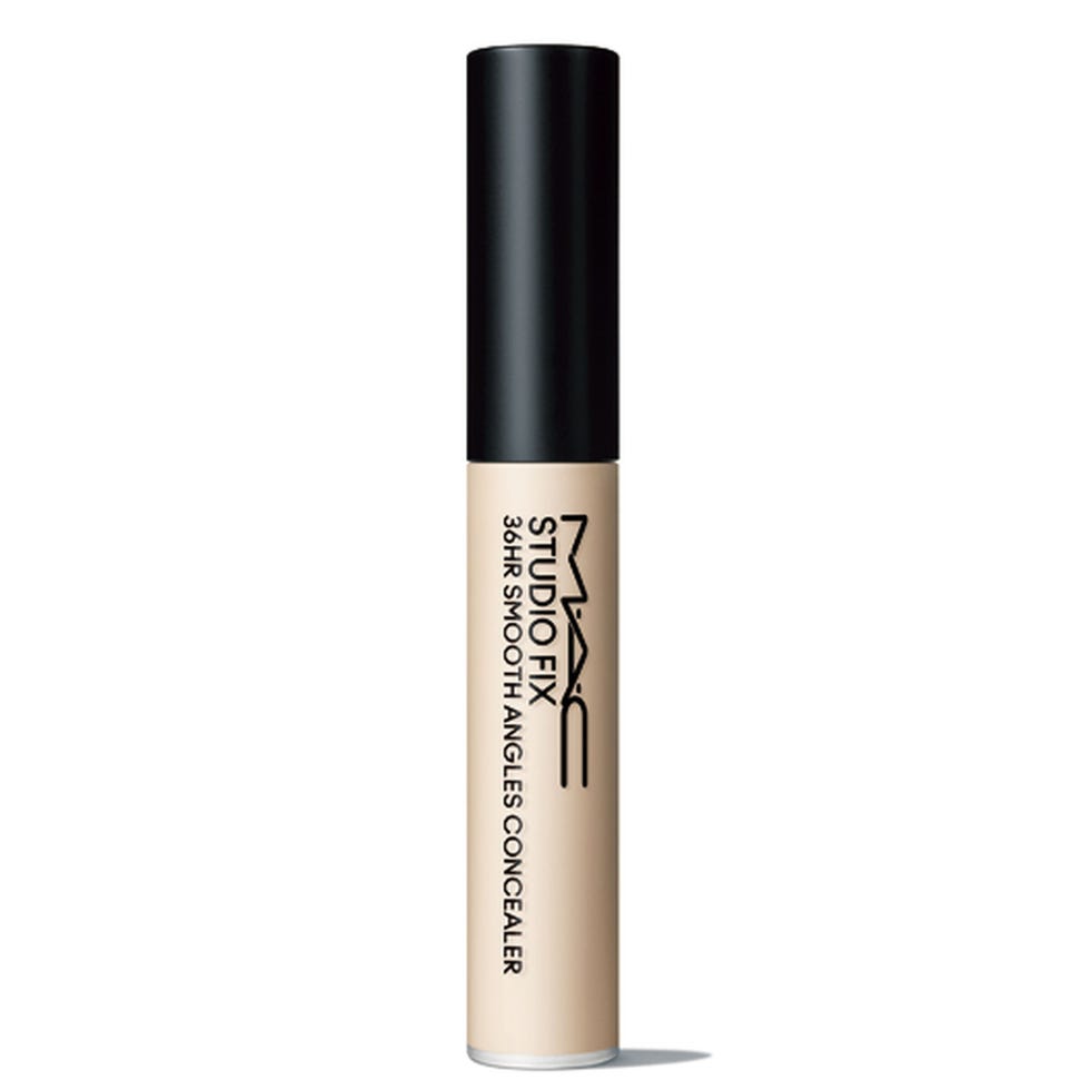 concealer tube with a black cap and a beige body