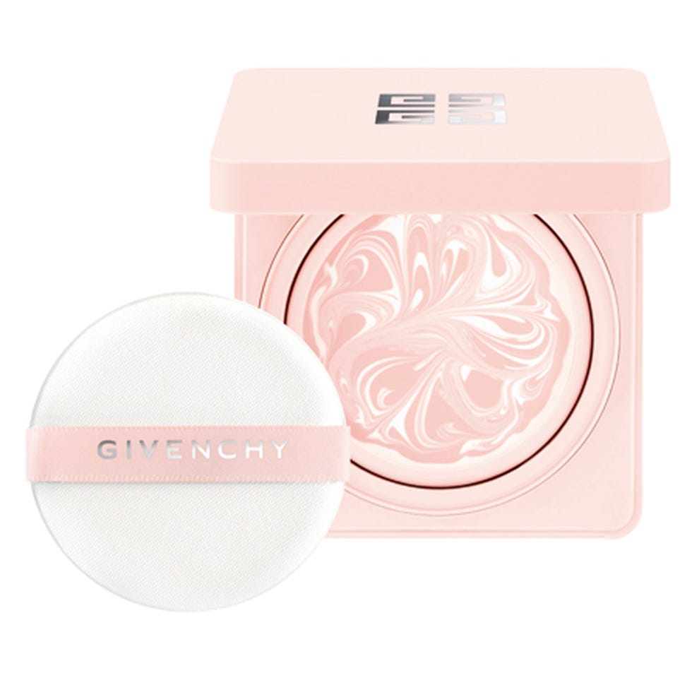 a pink cosmetic container with a creamy product and an applicator puff