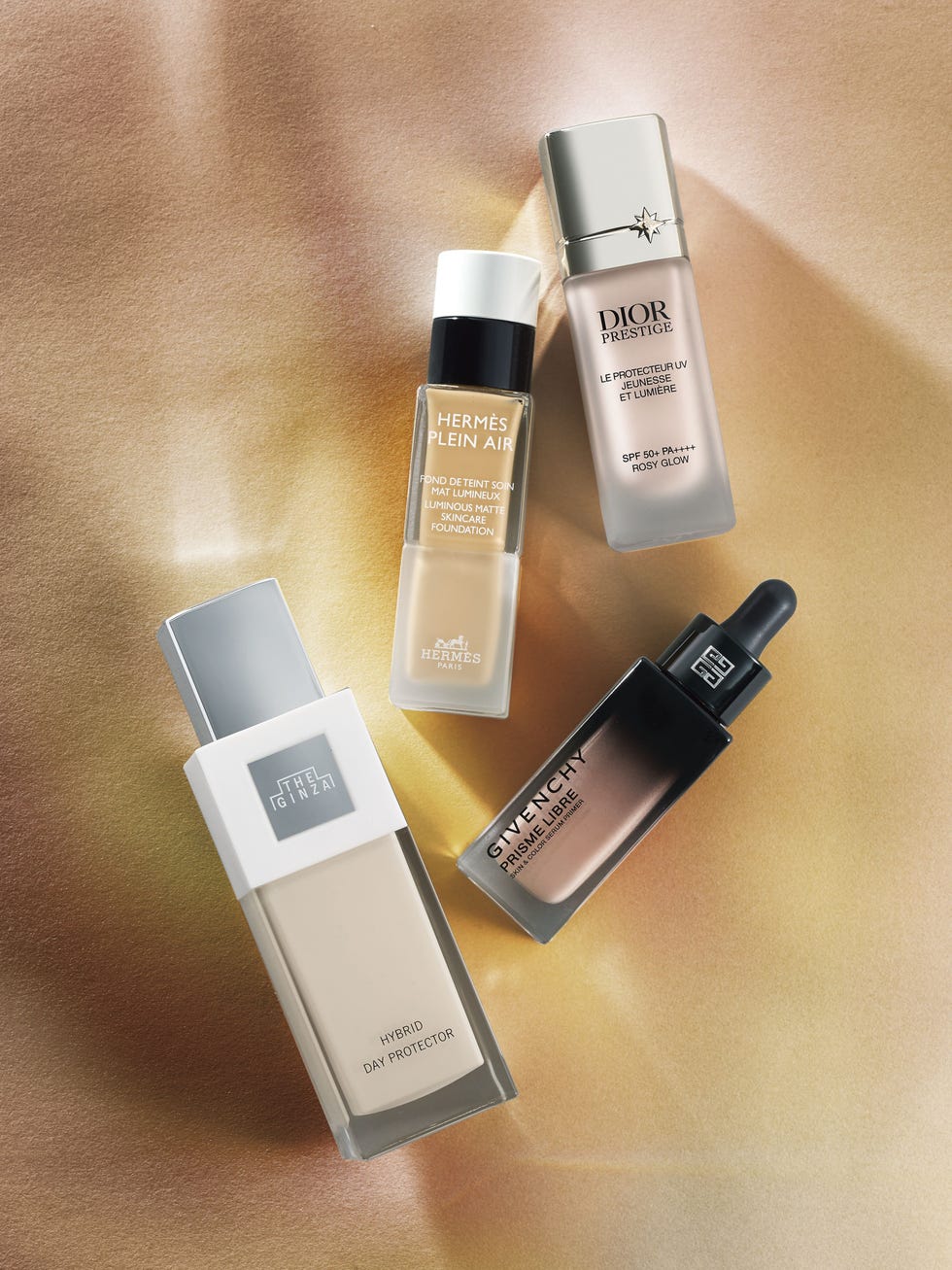 various luxury skincare and foundation products on a soft background
