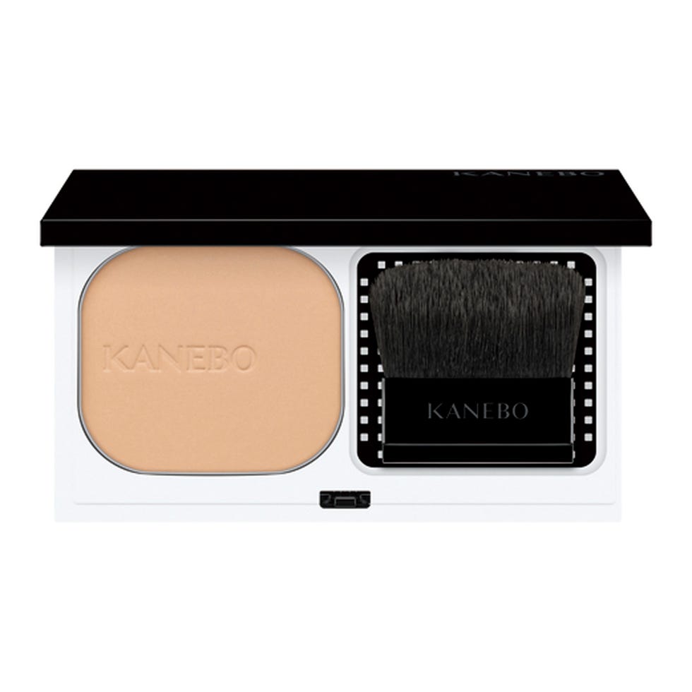 compact powder with an applicator brush