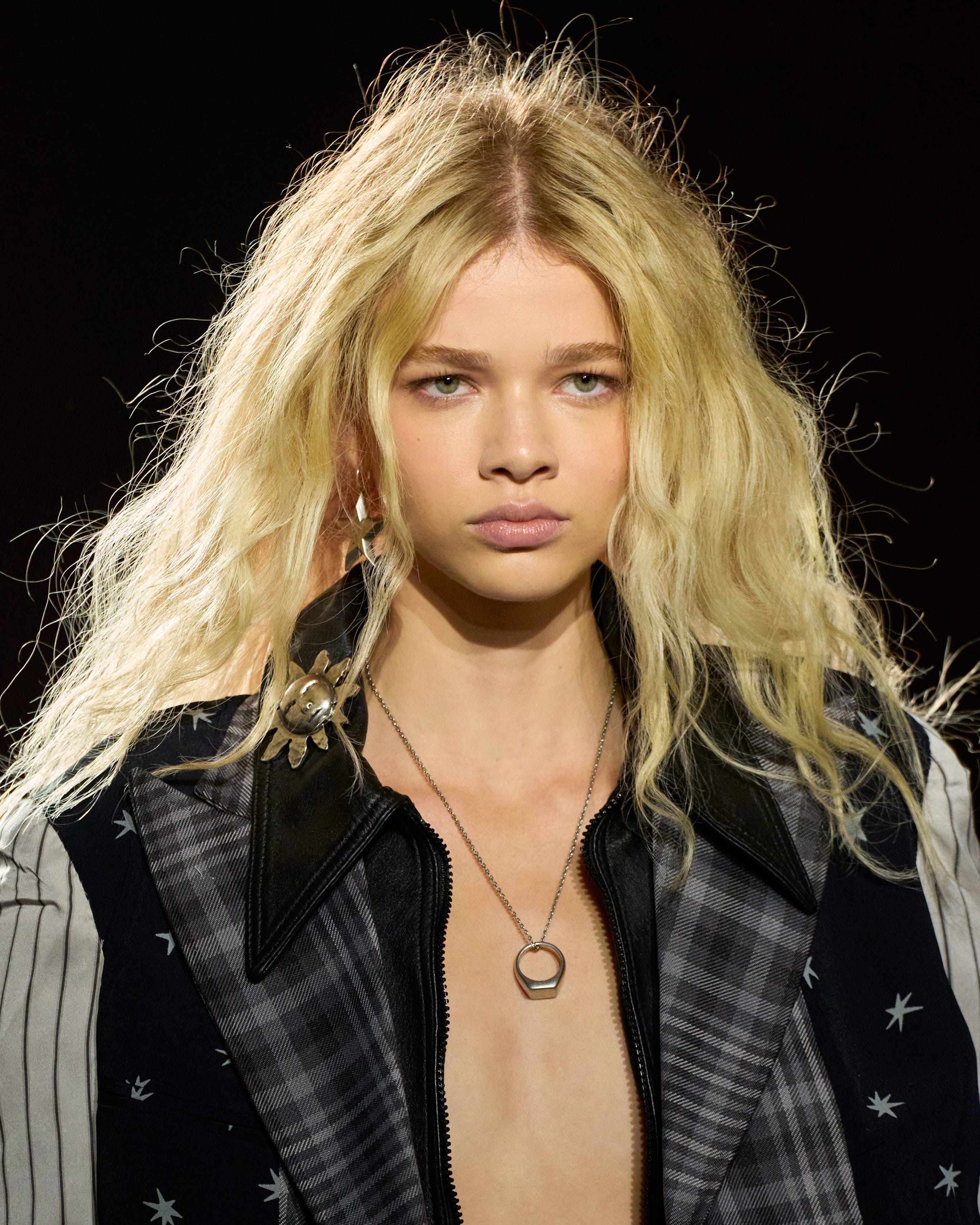 Fashion model showcasing an outfit on the runway.