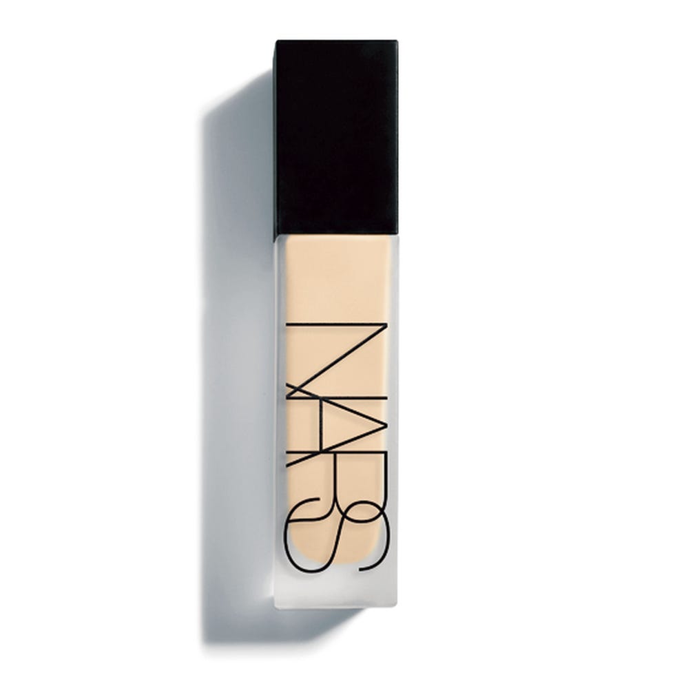 foundation bottle with a black cap and clear body showing creamy liquid