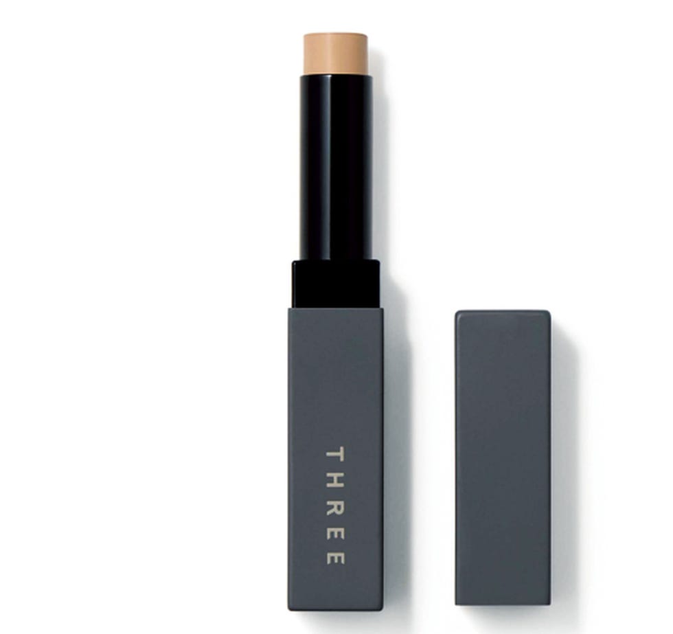 makeup stick with a cap next to it