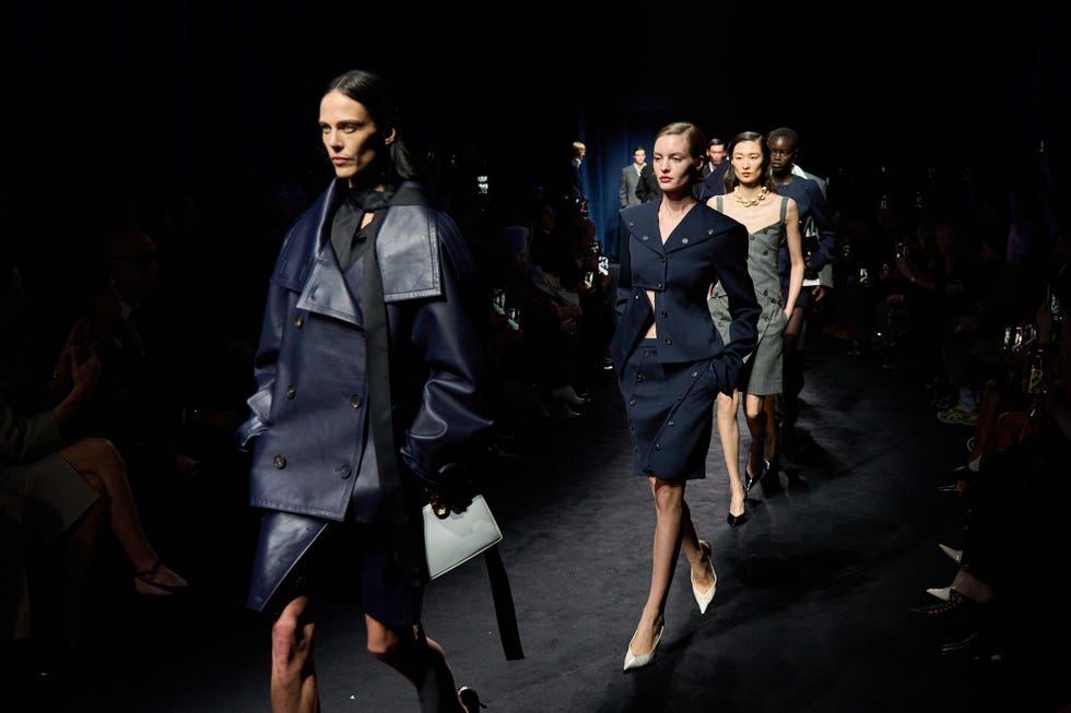 fashion runway show featuring models in stylish outfits