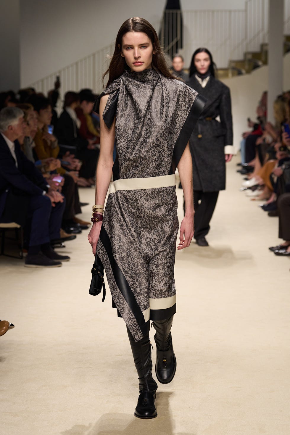 fashion model walking on a runway during a fashion show