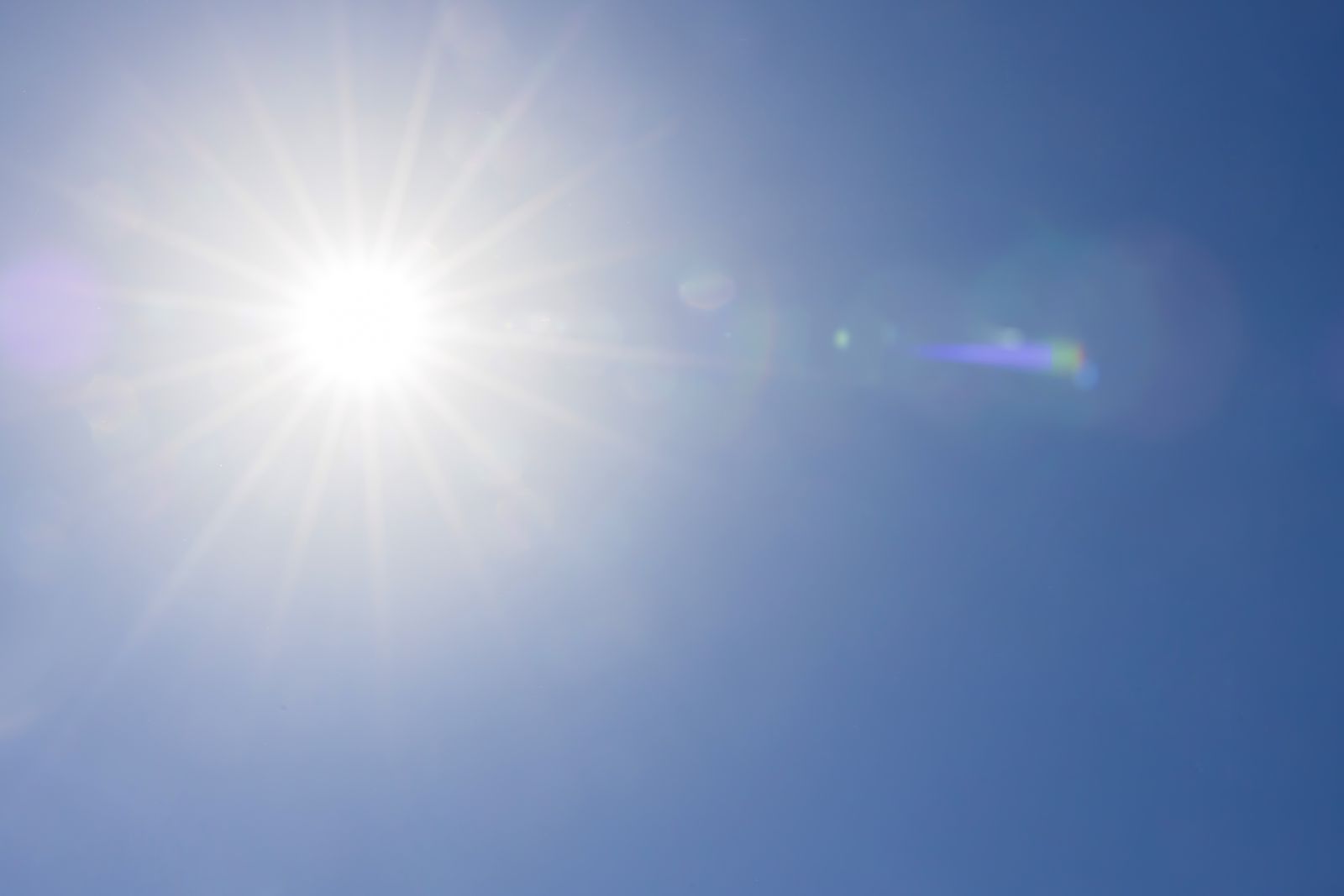 Full bright sun in the blue sky