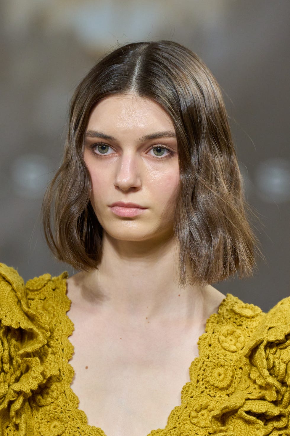 Fashion model wearing a yellow outfit